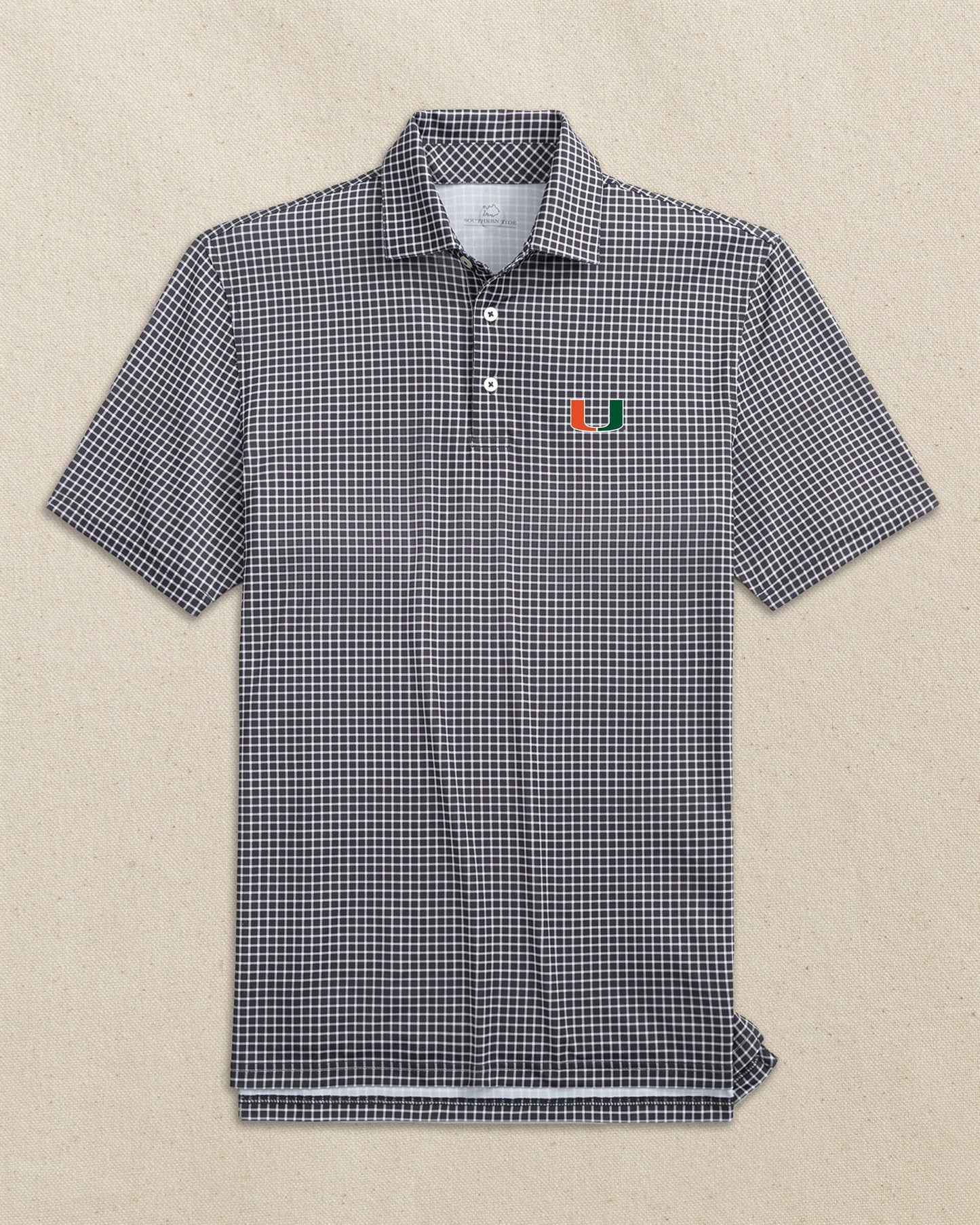 The front view of the Southern Tide Miami Hurricanes Driver Dunes Edge Plaid Polo by Southern Tide - Black